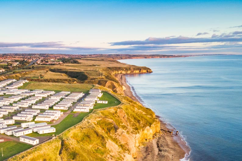 Caravans overlooking the dramatic cliffs of the Durham coastline at Crimdon Dene Holiday Park