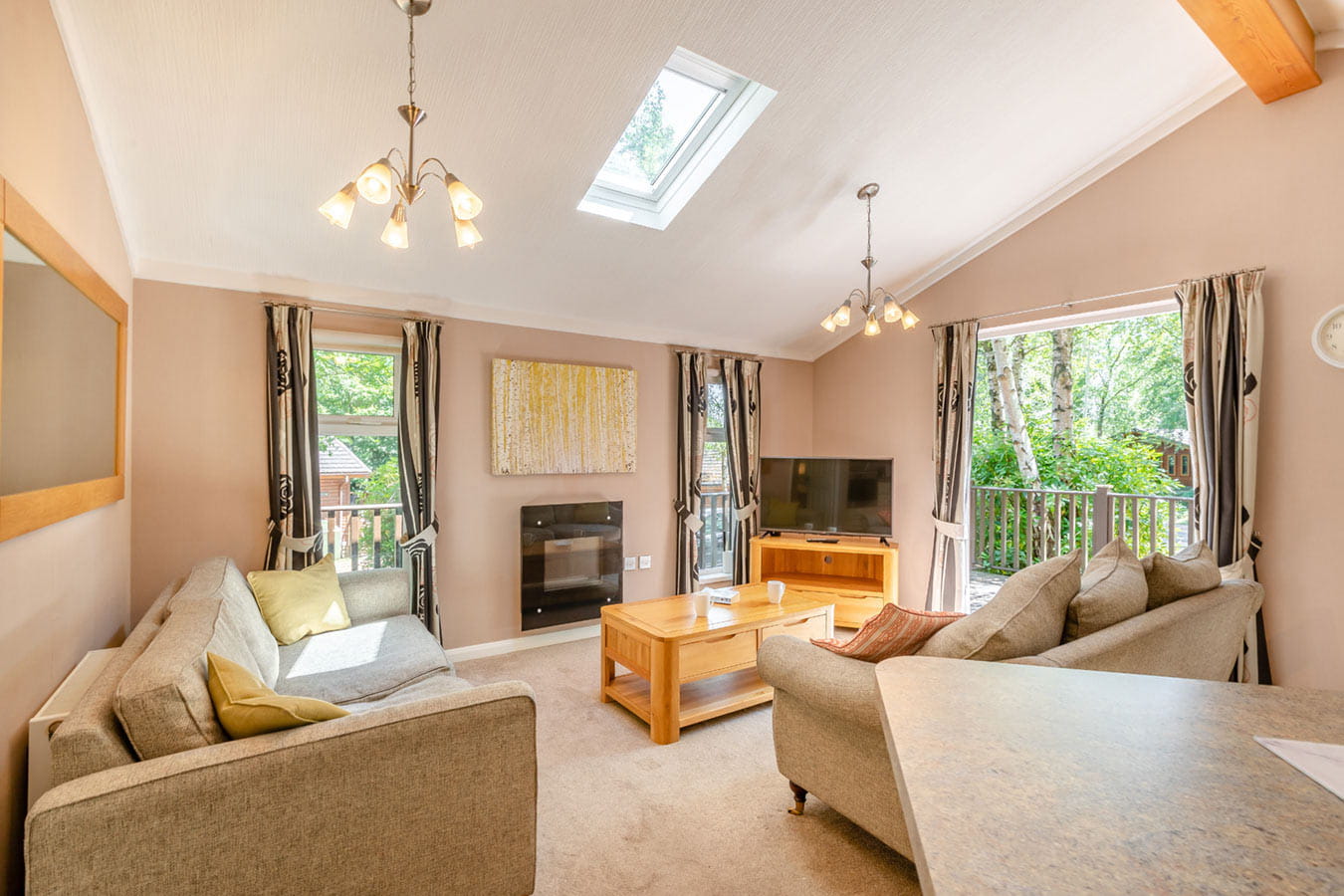 A stylish and cosy lounge inside a lodge at Parkdean Resorts