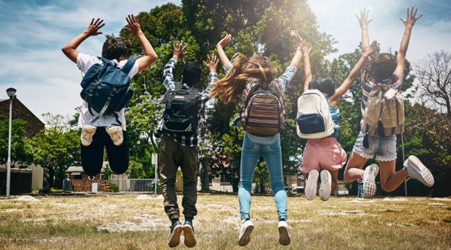 School children jumping in the air