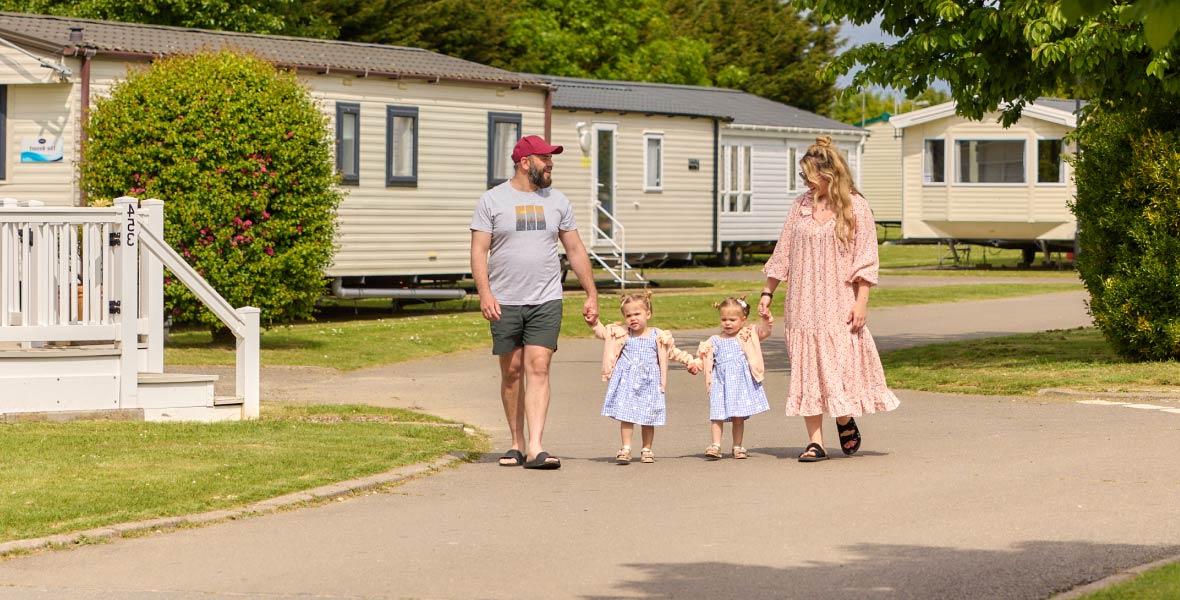 Family next to caravans