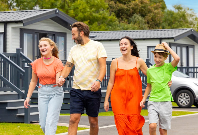 Family next to caravans