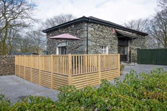 A holiday bungalow with a veranda at a Parkdean Resorts holiday park
