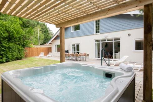 A large holiday rental with a hot tub and outdoor patio at a Parkdean Resorts holiday park