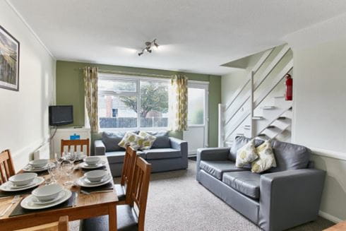 The lounge and dining area of a holiday maisonette at a Parkdean Resorts holiday park