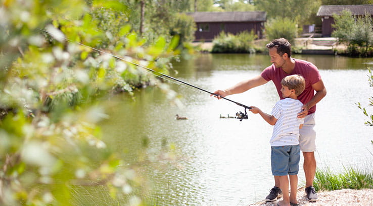 A father and son fishing on the lake at Warmwell