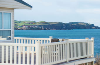 A lodge with a veranda overlooking the sea