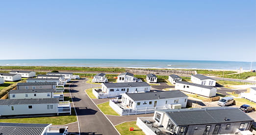 Lodges by the beach at Camber Sands Holiday Park in East Sussex