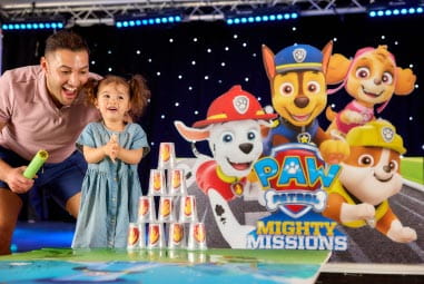 a child on stage at a PAW Patrol activity