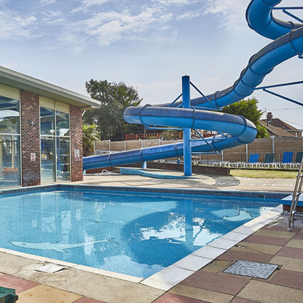 Outdoor pool and waterslide at Highfield Grange Holiday Park