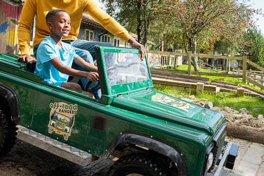 Boy in off road ranger car
