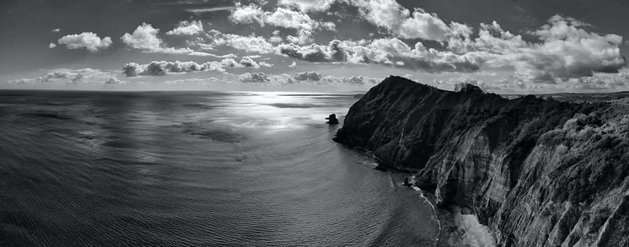 Black and white photo of sea cliffs