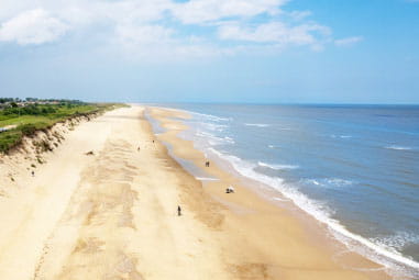 sandy beach with blue waters