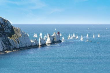beautiful blue waters with sailboats