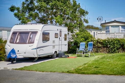 touring campervan moored up on a pitch