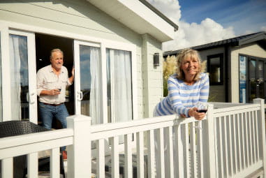 Family outside caravan