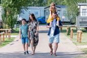 Family walking through parkdean resorts