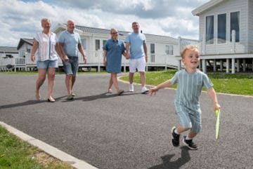 Family walking through parkdean resorts