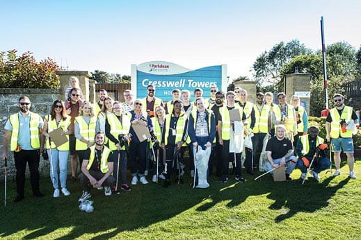 Parkdean Resorts staff posing for a photo at the annual beach clean