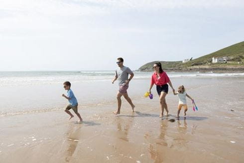 Family playing on beach