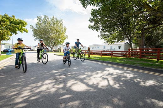 Family bike ride on holiday park