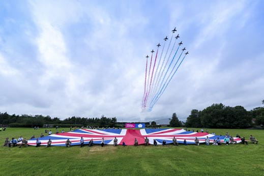 Red arrows fly over union jack flag