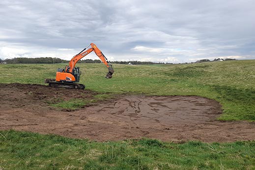 Digger on land