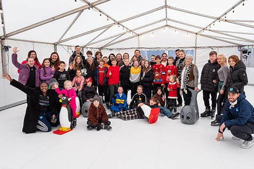 A group of people ice skating