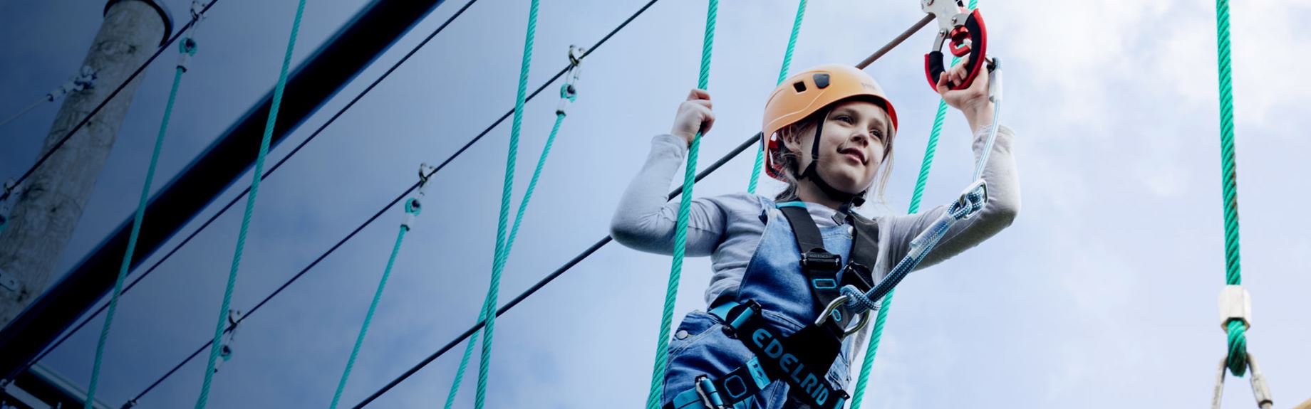 Little girl on the high ropes at Parkdean Resorts
