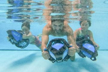 Family playing under water