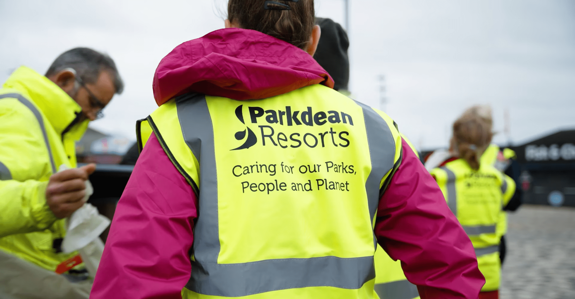Girl wearing high vis with Parkdean Resorts printed on the back