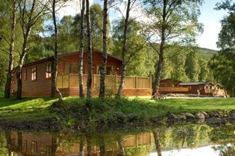 Wooden lodge beside a lake