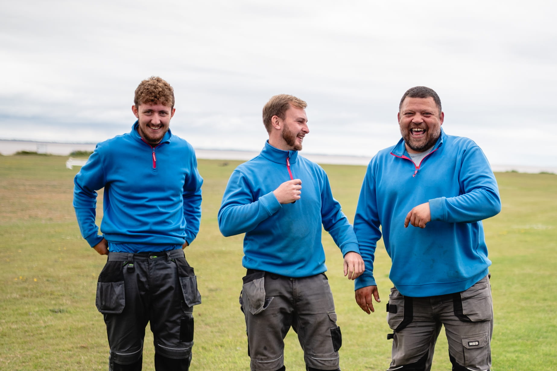 Laughing male coworkers
