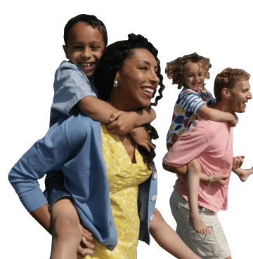 Man and woman giving their children a piggy back