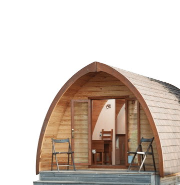 Wooden glamping pod with doors open