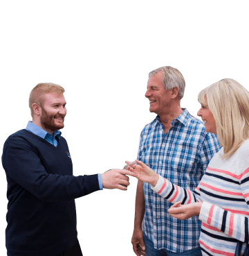 Parkdean Resorts member of staff handing over keys to a couple