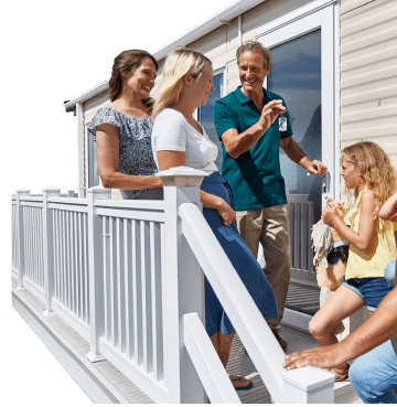 A group of people chatting on their caravan steps