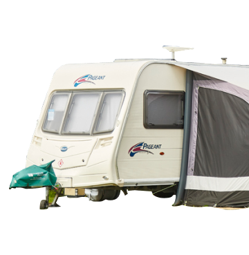 White caravan with awning on side 