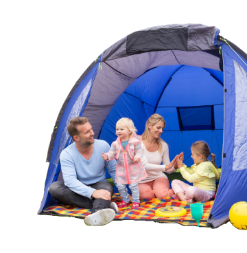 Family of four with two young children sat on a colourful blanket inside a blue tent