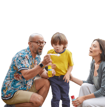 family blowing bubbles
