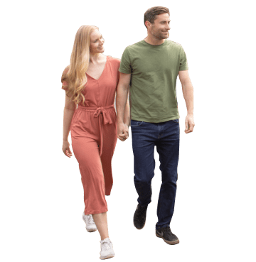 Man and woman walking holding hands