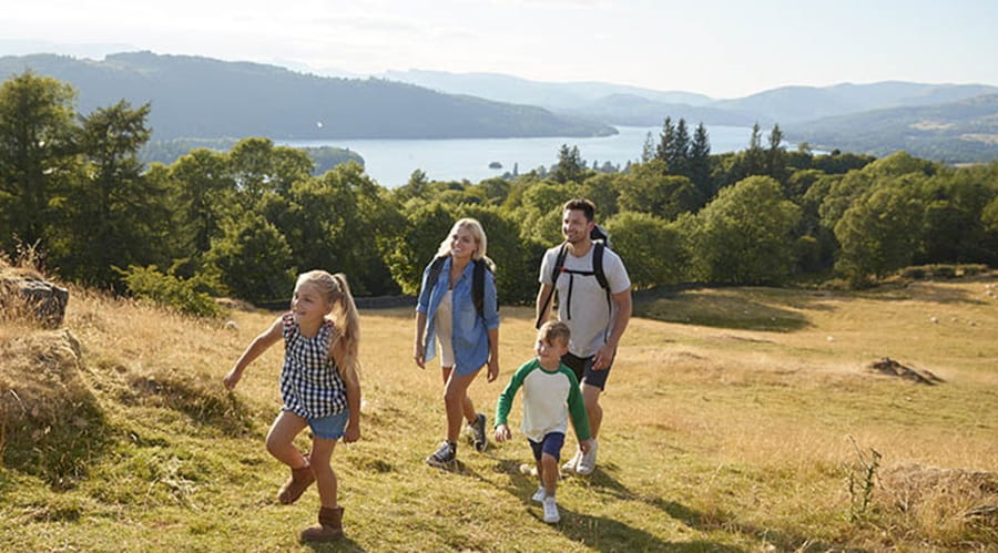 Family walking through English field