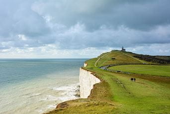 Walkers along the white cliffs of the South Downs Way, near Camber Sands