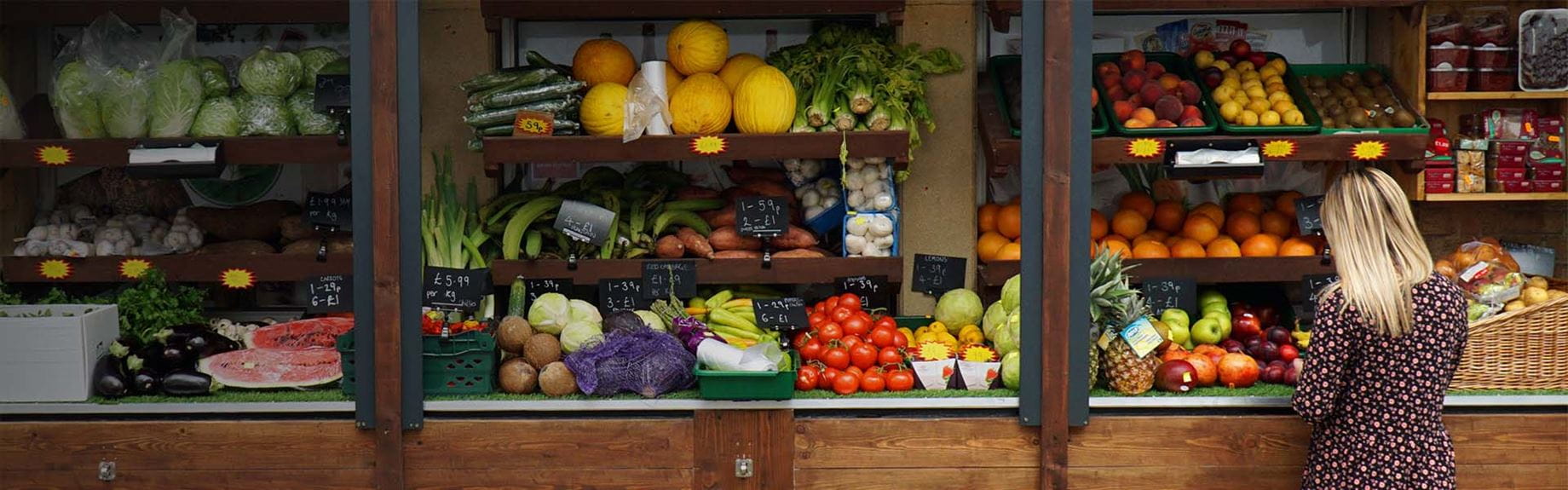 A market stall displaying fresh fruit and vegetables