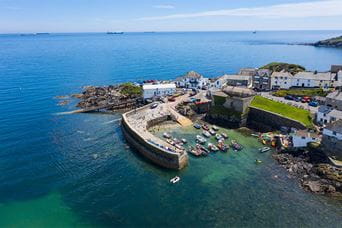 A fishing village and harbour on the Lizard peninsula in Cornwall