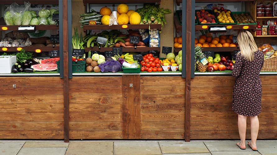 A market stall displaying fresh fruit and vegetables