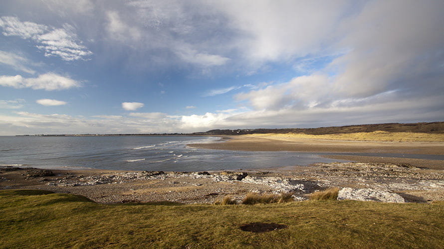 A view over the river mouth and sea at Ogmore Beach in South Wales