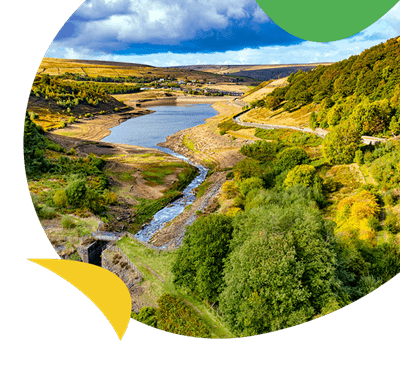 A spectacular view over a reservoir in Yorkshire, with golden autumn trees