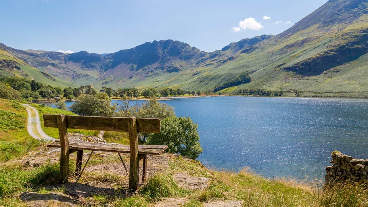 A bench overlooking Buttermere in the Lake District on a spring day