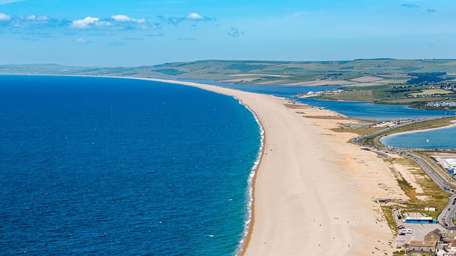An aerial view over 18 mile long Chesil Beach in Dorset