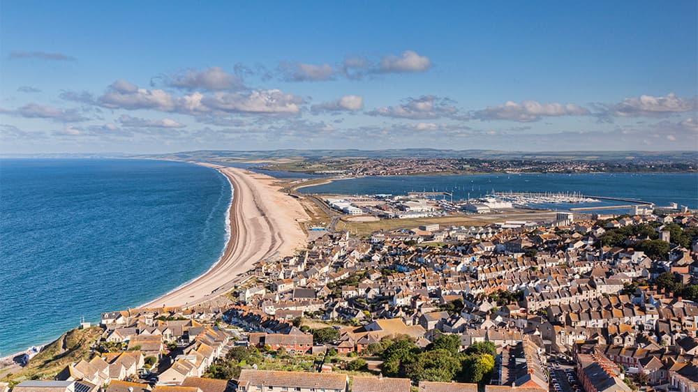 A view over Chesil Beach and a local town in Dorset